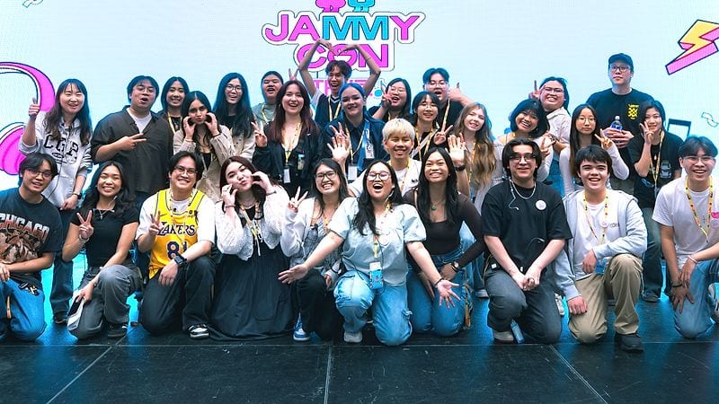 The JAMMY Crew posing together on stage beneath the JAMMY CON logo.